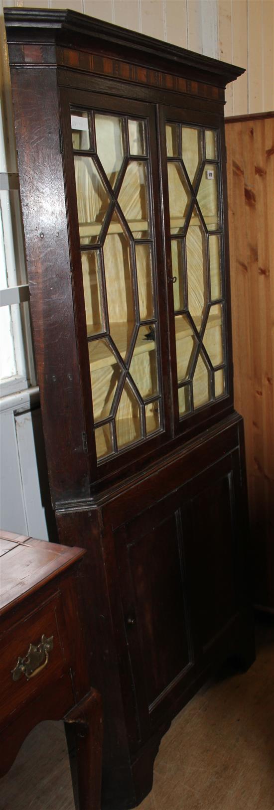 Oak glazed standing corner cupboard